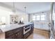 Bright kitchen with large island, stainless steel appliances, and hardwood floors at 1063 Ormewood Ave, Atlanta, GA 30316