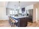 Modern kitchen with white cabinets, large island, and stainless steel appliances at 1063 Ormewood Ave, Atlanta, GA 30316