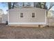 Rear view of house showing additional building and fenced yard at 748 Amber Nw, Atlanta, GA 30331
