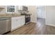 Renovated kitchen with stainless steel appliances and granite countertops at 748 Amber Nw, Atlanta, GA 30331