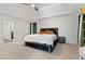Spacious primary bedroom with plush carpet and en-suite bathroom access at 2528 Shropshire Pl, Mcdonough, GA 30253