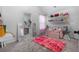 Charming bedroom with pink rug and a vanity area at 2528 Shropshire Pl, Mcdonough, GA 30253