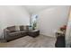 Versatile bonus room with L-shaped sofa and ample floor space at 2528 Shropshire Pl, Mcdonough, GA 30253