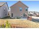 Tan house with backyard patio, and grassy area at 2528 Shropshire Pl, Mcdonough, GA 30253