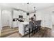 Modern kitchen with white cabinets, island, and stainless steel appliances at 2528 Shropshire Pl, Mcdonough, GA 30253