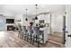 Modern kitchen with white cabinets, island, and stainless steel appliances at 2528 Shropshire Pl, Mcdonough, GA 30253