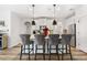 Kitchen island with seating and quartz countertop at 2528 Shropshire Pl, Mcdonough, GA 30253