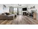 Spacious living room boasts a cozy fireplace and comfortable sectional sofa at 2528 Shropshire Pl, Mcdonough, GA 30253