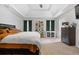 Large main bedroom with plush bedding and tray ceilings at 2528 Shropshire Pl, Mcdonough, GA 30253