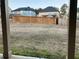 Large backyard with wooden privacy fence and grassy area at 7594 Shady Maple Way, Lithonia, GA 30038