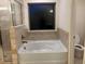 Bathroom boasts a garden tub, shower, and updated fixtures at 7594 Shady Maple Way, Lithonia, GA 30038