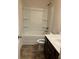 Clean bathroom with a tub shower combo, toilet, and vanity at 7594 Shady Maple Way, Lithonia, GA 30038