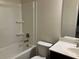 Bathroom features a shower/tub combo and modern vanity at 7594 Shady Maple Way, Lithonia, GA 30038