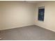 Simple bedroom with window and neutral wall paint at 7594 Shady Maple Way, Lithonia, GA 30038