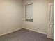 Bright bedroom with window and neutral wall paint at 7594 Shady Maple Way, Lithonia, GA 30038