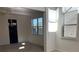 Spacious dining room with chandelier and two windows, offering natural light at 7594 Shady Maple Way, Lithonia, GA 30038