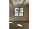 Bright dining room with chandelier, neutral walls, and large windows at 7594 Shady Maple Way, Lithonia, GA 30038