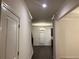 Bright entry hall with hardwood floors and views to the living room and stairs at 7594 Shady Maple Way, Lithonia, GA 30038