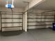 Two-car garage with automatic garage door opener and epoxy floor at 7594 Shady Maple Way, Lithonia, GA 30038