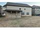 Two-story house with a covered patio and backyard at 7594 Shady Maple Way, Lithonia, GA 30038
