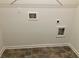 Laundry room with tile flooring and hookups for washer and dryer at 7594 Shady Maple Way, Lithonia, GA 30038