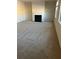Spacious living room featuring a fireplace and plush carpeting at 7594 Shady Maple Way, Lithonia, GA 30038