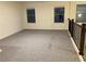 Spacious loft bedroom with new carpet and two windows at 7594 Shady Maple Way, Lithonia, GA 30038