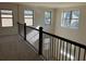 Loft area overlooking the main floor with a view of the living room at 7594 Shady Maple Way, Lithonia, GA 30038