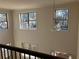 View from the loft showcasing large windows and natural light at 7594 Shady Maple Way, Lithonia, GA 30038