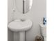 Simple bathroom with pedestal sink and toilet at 1752 Alford Dr, Jonesboro, GA 30236