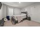 Simple bedroom with a full-size bed and nightstand at 1752 Alford Dr, Jonesboro, GA 30236