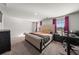 Bright bedroom featuring a king-size bed and ample natural light at 1752 Alford Dr, Jonesboro, GA 30236