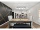 Elegant dining room with farmhouse table and statement wall at 1752 Alford Dr, Jonesboro, GA 30236