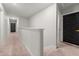 Clean hallway with carpeted floors and neutral walls at 1752 Alford Dr, Jonesboro, GA 30236