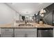 Kitchen island with granite countertop, double sink, and seating for six at 1752 Alford Dr, Jonesboro, GA 30236