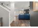 Bright living room with hardwood floors, a fireplace, and a blue couch at 1752 Alford Dr, Jonesboro, GA 30236