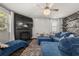 Relaxing living room with fireplace and large TV at 1752 Alford Dr, Jonesboro, GA 30236