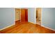 Bedroom with hardwood floors and access to bathroom at 2963 Thompson Cir, Decatur, GA 30034