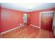 Bedroom with hardwood floors and coral walls at 2963 Thompson Cir, Decatur, GA 30034