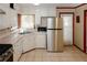 Kitchen with stainless steel refrigerator and white cabinets at 2963 Thompson Cir, Decatur, GA 30034