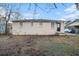 Brick home with a modest backyard and a partially visible car at 3355 Renault Se Rd, Atlanta, GA 30354