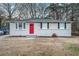Charming ranch home with red front door and well-maintained lawn at 3355 Renault Se Rd, Atlanta, GA 30354
