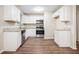 Modern kitchen with white cabinets and granite countertops at 3355 Renault Se Rd, Atlanta, GA 30354