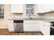 Modern kitchen with white cabinets, granite counters, and stainless steel dishwasher at 3355 Renault Se Rd, Atlanta, GA 30354