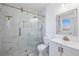 Updated bathroom, featuring a frameless glass shower with marble tile and gold fixtures at 3293 Abbeywood Dr, Decatur, GA 30034