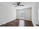 Well-lit bedroom with dark hardwood floors and a ceiling fan at 3293 Abbeywood Dr, Decatur, GA 30034