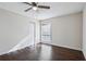 Bright bedroom with dark hardwood floors and ceiling fan at 3293 Abbeywood Dr, Decatur, GA 30034