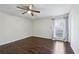 Bright bedroom with hardwood floors, a ceiling fan and window with curtains at 3293 Abbeywood Dr, Decatur, GA 30034