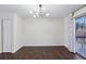 Dining room with dark hardwood floors and access to deck at 3293 Abbeywood Dr, Decatur, GA 30034