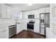 Updated kitchen, stainless steel appliances, white cabinets at 3293 Abbeywood Dr, Decatur, GA 30034